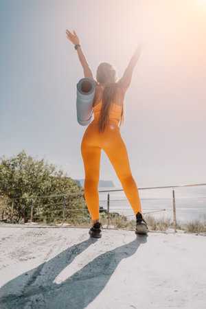 Woman in Orange Leggings Reaching for the Sky