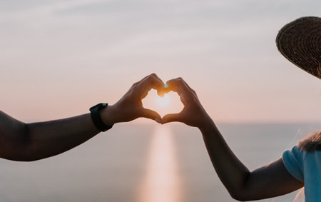 Sunset Heart Formation by Coupleの写真素材