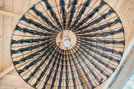 Wicker Lamp Shade with Lightbulbの写真素材