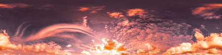 360 panorama of glowing sunset sky with bright Cirrus clouds. Seamless hdr spherical 360 panorama. Sky dome in 3D visualization, sky replacement for aerial drone panoramas. Weather and climate changeの写真素材
