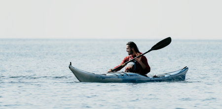 Kayaking Person Water Paddle - Kayaker paddling on the water during the day.