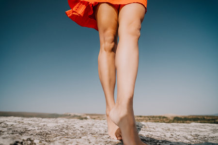 Barefoot Woman on a Cliff, Summer Dayの写真素材