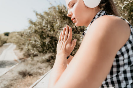Woman Praying with Hands Together, Outdoorsの写真素材