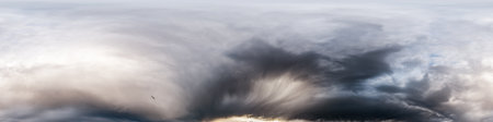 Dark moody rain clouds in dramatic overcast sky. Seamless 360 HDR spherical panorama. Full zenith or...