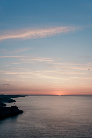 Sunset Over a Calm Seaの写真素材
