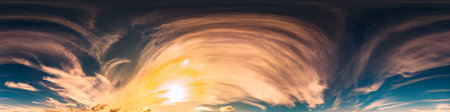 360 panorama of glowing sunset sky with bright Cirrus clouds. Seamless hdr spherical 360 panorama. Sky dome in 3D visualization, sky replacement for aerial drone panoramas. Weather and climate changeの写真素材