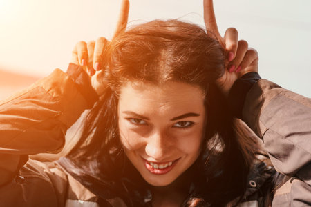 Portrait of a Playful Young Woman with Brown Hairの写真素材