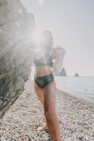 Woman in a Bikini on the Beach with Sun Glareの写真素材