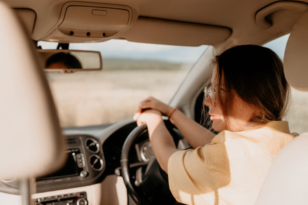 Woman Driving on a Sunny Dayの写真素材