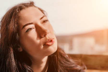Woman Portrait Close-up Sunlight Face Expressionの写真素材