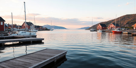 Scandinavian Archipelago with Wooden Docks Small, picturesque islands with red and white wooden cottages dot the calm watersの素材