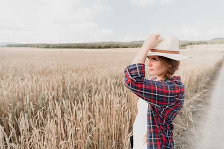 Young Woman in a Wheat Fieldの写真素材