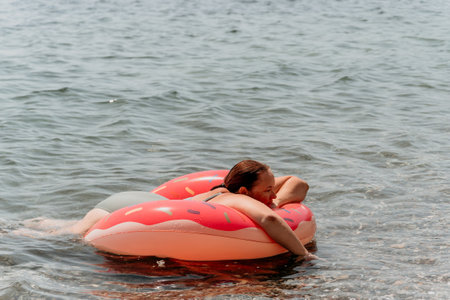 Woman Inflatable Float Lake Summer Vacationの写真素材