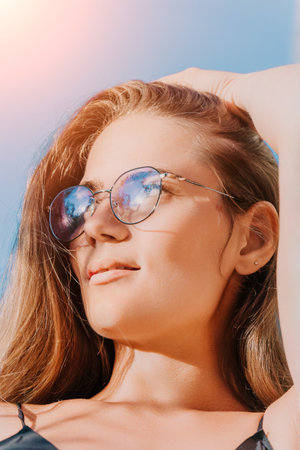Woman Sunglasses Beach Sun Protection Smiling Woman Wearing Sunglasses on Beach in Summer, Protected...