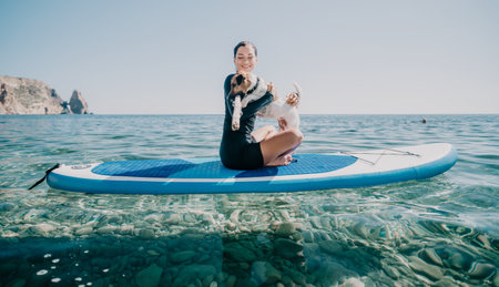 Woman Paddleboard Yoga Ocean - Woman practicing yoga on a paddleboard in the ocean, showcasing a...