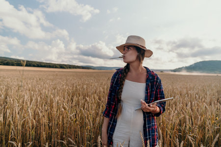 Woman in a Wheat Field with a Tabletの写真素材