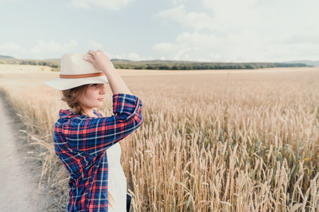 Young Woman in a Wheat Fieldの写真素材