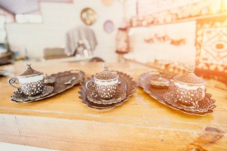 Three Traditional Turkish Coffee Cups on Wooden Trayの写真素材