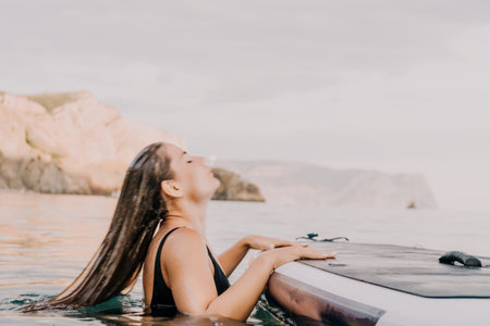 Woman, Boat, Water - Relaxing in the Lake on a Summer Day.