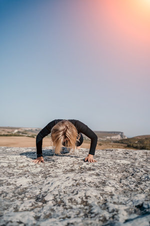 Woman Doing a Push-up on a Cliff
