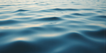 Rippling Water Reflections with Soft Blues A tranquil close-up of gentle ripples on a calm lake, reflecting the skyの素材