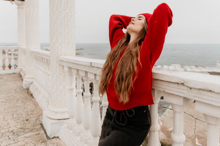 Woman Relaxation Ocean View Balcony Serene Pensive Momentの写真素材