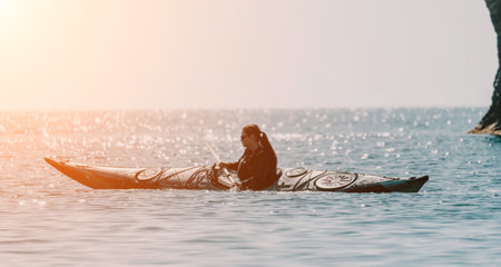 Kayaking Ocean Sunset Man paddling kayak in ocean at sunset.の写真素材