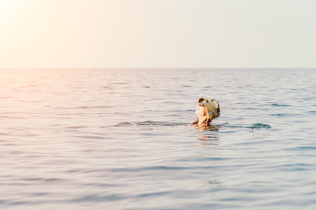 Woman Swimming Sea Calm Water, a woman swimming in the calm water of the sea.の写真素材