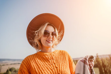 Smiling Woman in a Brown Hat and Sunglasses