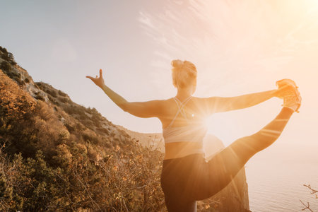 Woman Doing Yoga Pose With Ocean and Mountains in the Background
