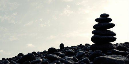 Stacked Stones Silhouette A silhouette of stacked stones against a white background. Simple, minimalist design.の素材