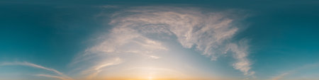 360 panorama of glowing sunset sky with bright Cirrus clouds. HDR 360 seamless spherical panorama. Full zenith or sky dome sky replacement for aerial drone panoramas. Climate and weather change.の写真素材