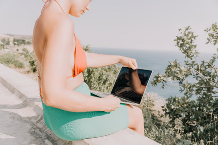 Woman Laptop Beach Working Remotelyの写真素材