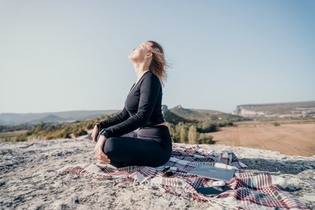Woman in Black Outfit Enjoying the Mountain Viewの写真素材