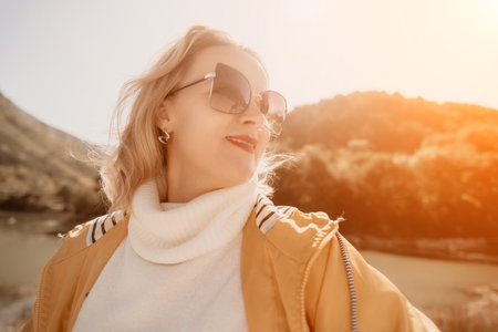 Blond Woman in Sunglasses Looking at the View