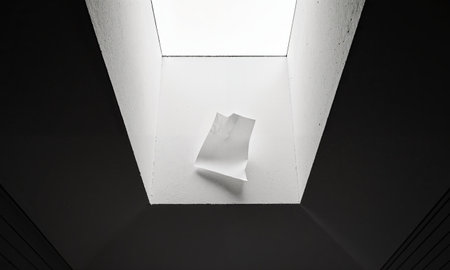 The Ventilation Draft. A thin piece of paper, caught in a perpetual draft from a ventilation shaft, flutters endlesslyの素材