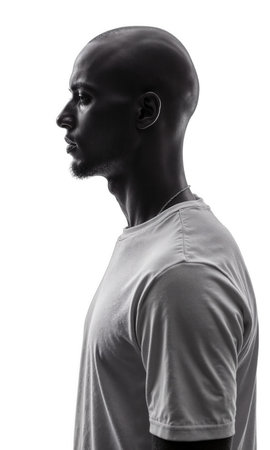 Man profile portrait black male with shaved head wearing a tshirt against white background with copy space for conceptsの素材