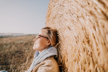 Relaxing by the Hay Bale: A Moment of Tranquility