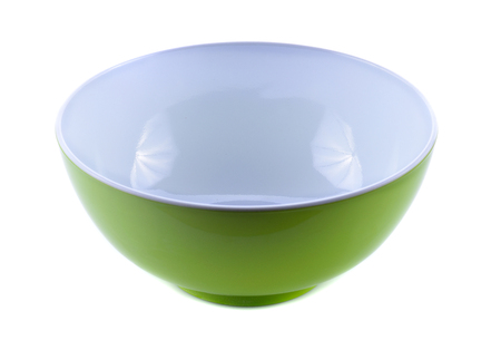 Empty green plastic bowl isolated on whiteの写真素材