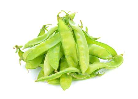 fresh green peas isolated on a white backgroundの写真素材