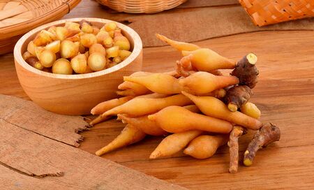 Fingerroot, Kaempfer, Boesenbergia on wooden floorの写真素材