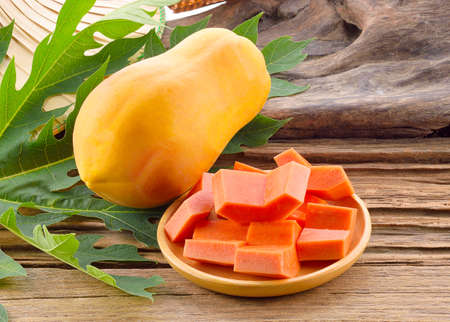Papaya on a wooden backgroundの写真素材