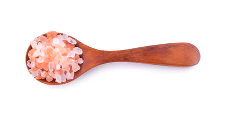 Pink salt in a wooden spoon on a white backgroundの写真素材