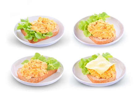 Sliced bread with scrambled eggs, black pepper isolated on white background.の写真素材
