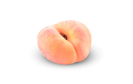 Ripe chinese flat peach fruit isolated on white backgroundの写真素材