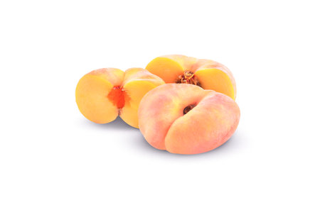 Ripe chinese flat peach fruit isolated on white backgroundの写真素材