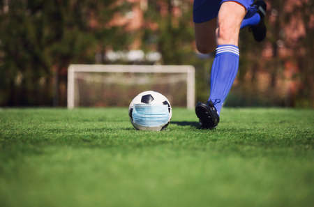 Euro soccer cancellation event concept. Ball with coronavirus maskの写真素材