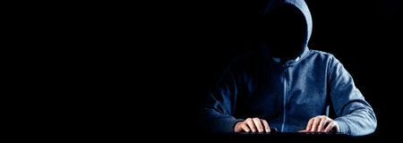 Hacker prints a code on a laptop keyboard to break into a cyberspace