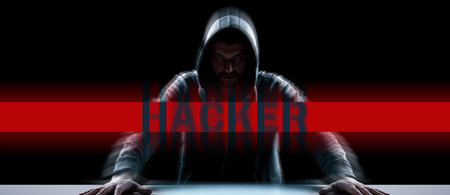 Hacker prints a code on a laptop keyboard to break into a cyberspace