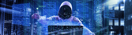 Hacker prints a code on a laptop keyboard to break into a cyberspace